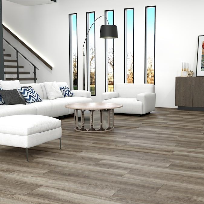 STAINMASTER PetProtect Pheasant Lane Oak 12-mm T x 7-1/2-in W x 50-in L Waterproof Wood Plank Laminate Flooring (23.69-sq ft / Carton)