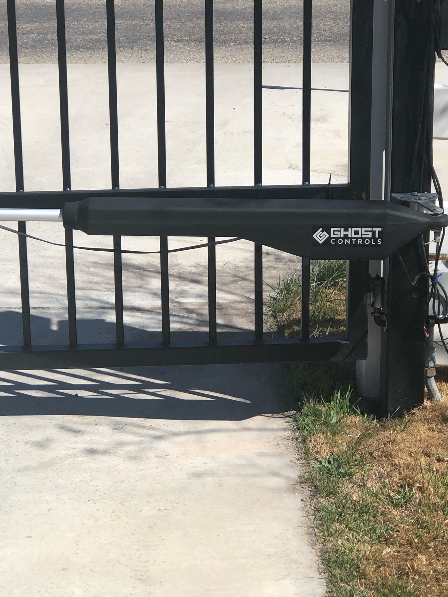 Ghost Controls 20-ft Single Swing Universal Battery Driveway Gate Opener Kit (Solar Compatible)