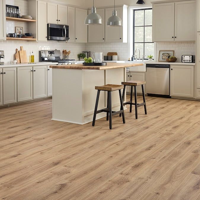 STAINMASTER PetProtect Tanglewood Oak 12-mm T x 7-1/2-in W x 47-1/4-in L Waterproof Wood Plank Laminate Flooring (22.09-sq ft / Carton)
