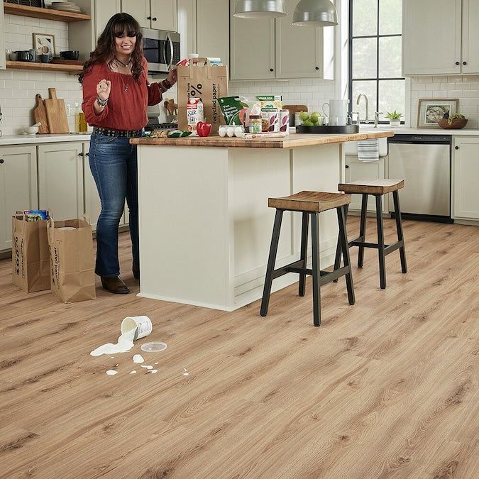 STAINMASTER PetProtect Tanglewood Oak 12-mm T x 7-1/2-in W x 47-1/4-in L Waterproof Wood Plank Laminate Flooring (22.09-sq ft / Carton)