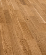allen + roth European white oak Amber is an Oak wood floor with brown, a wire brushed texture, and a low-gloss finish that highlights the wood’s natural variation hardwood flooring — primary plank view