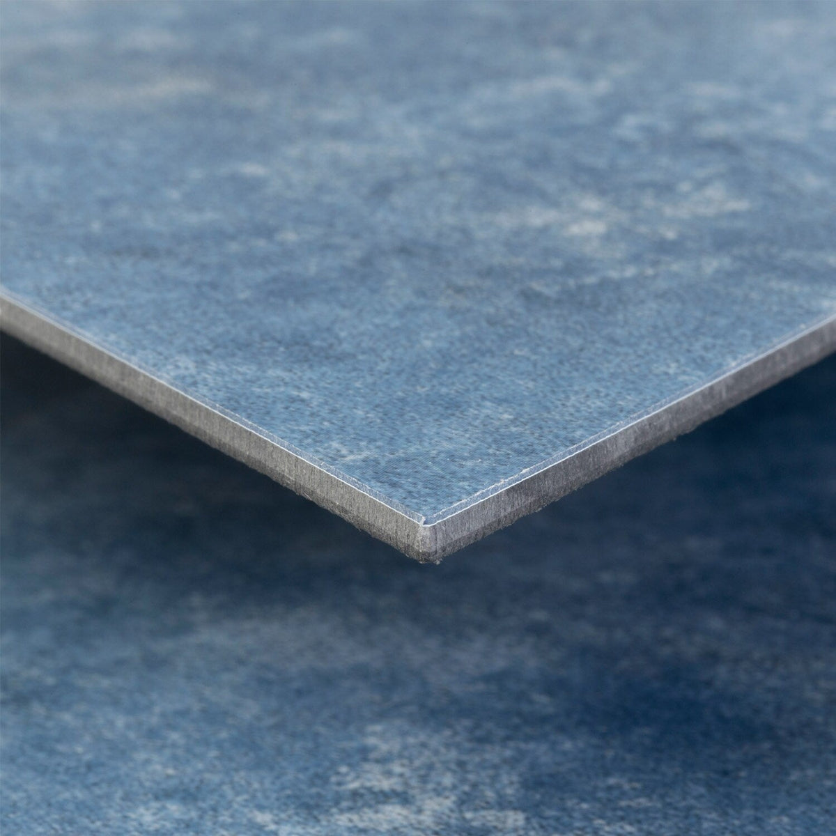 Lucida USA Moody Sky Blue Stone Look 28-mil x 10-in W x 16-in L Waterproof Glue Down Luxury Vinyl Tile Flooring (15.15-sq ft/ Carton)