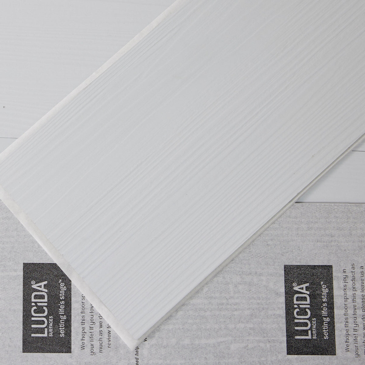Lucida USA BaseCore Blanc White 12-mil x 6-in W x 36-in L Waterproof Peel and Stick Vinyl Plank Flooring (54-sq ft/ Carton)