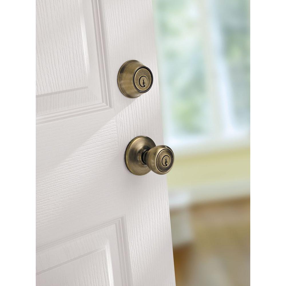 Tylo Antique Brass Entry Door Knob and Single Cylinder Deadbolt Combo Pack with Microban Antimicrobial Technology - Super Arbor