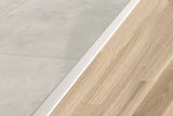 Schluter Systems RENO-T 0.344-in W x 98.5-in L Solid Brass T-Shape Tile Edge Trim - Brass