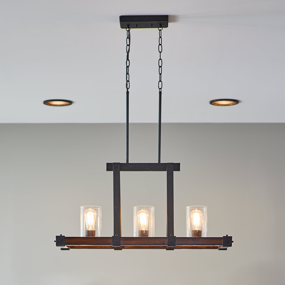 Kichler Barrington Distressed Black & Wood Tone Linear Kitchen Island Light with Clear Seeded Glass, 32 in.